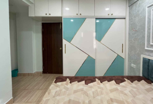 Two-tone laminate wardrobe design by Chennai’s expert interior designers
