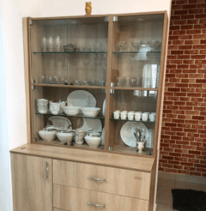 Glass-front wardrobe showcasing luxury storage by interior designers in Chennai