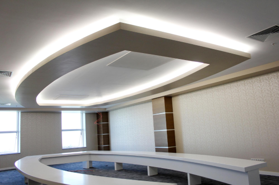 False ceiling with layered lighting installed by expert interior designers in OMR.